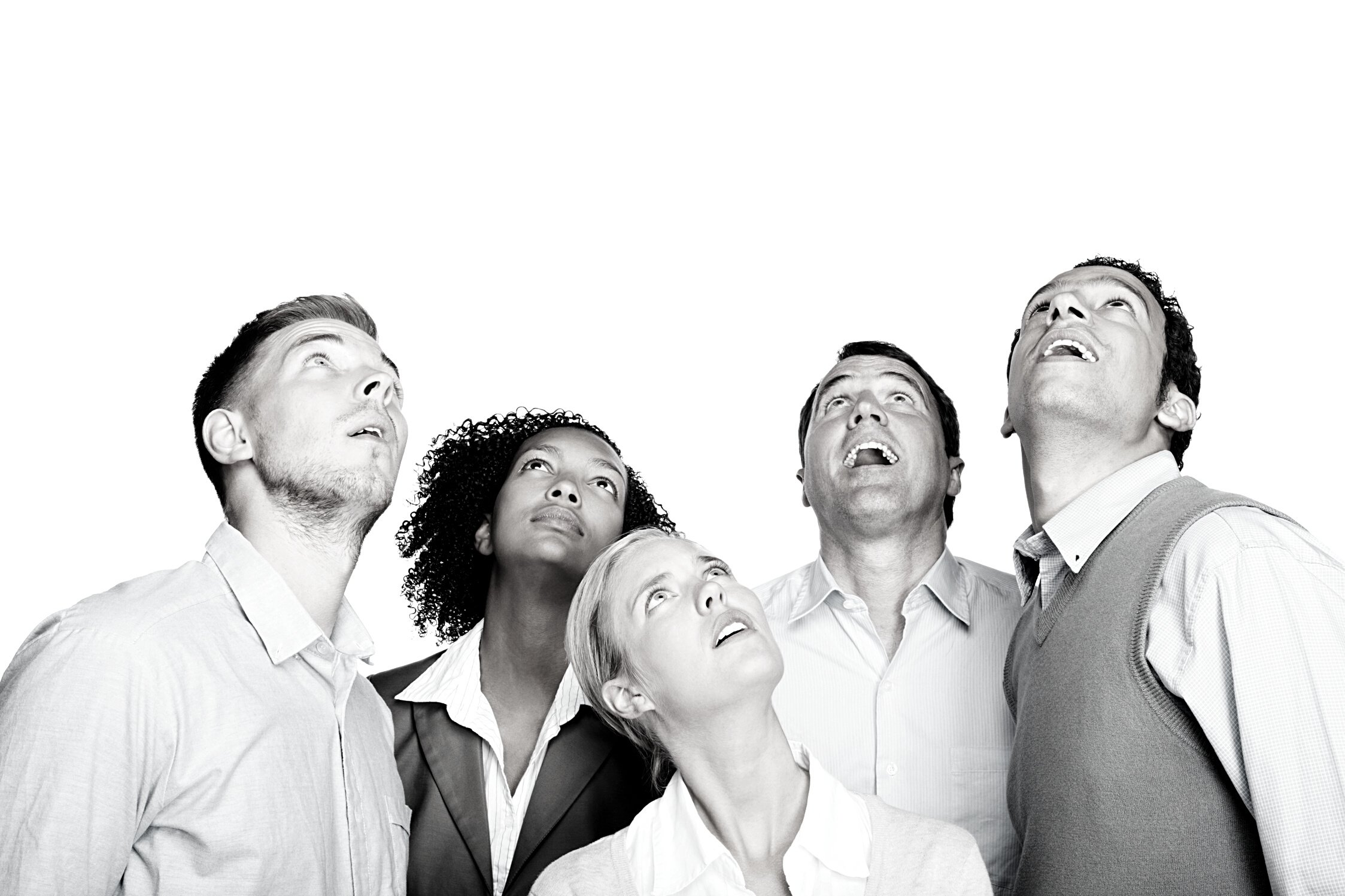 Surprised business people looking up at copy space